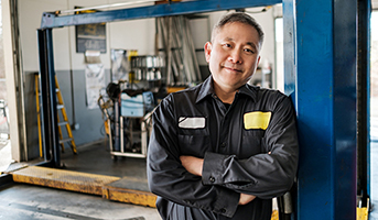 Mechanic Standing In Shop